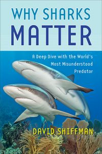 Blue book cover of “Why Sharks Matter” featuring a photo of two sharks underwater